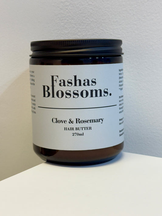 Jar of Fashas Blossoms Clove & Rosemary Hair Butter on a white surface with a light gray background