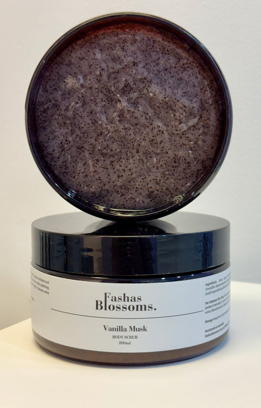 Jar of Fashas Blossoms Vanilla Musk body scrub with open lid on a white background