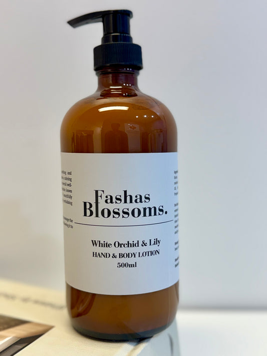 Brown bottle of Fashas Blossoms hand and body lotion on a white background