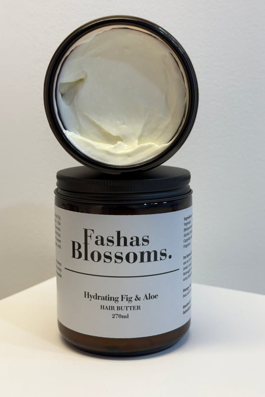 Jar of Fashas Blossoms hair butter with a black lid on a white background