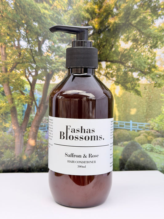Hair conditioner bottle labeled 'Fashas Blossoms' with a scenic background