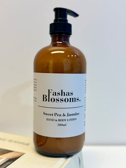 Brown bottle of Fashas Blossoms Sweet Pea & Jasmine hand and body lotion on a white surface.