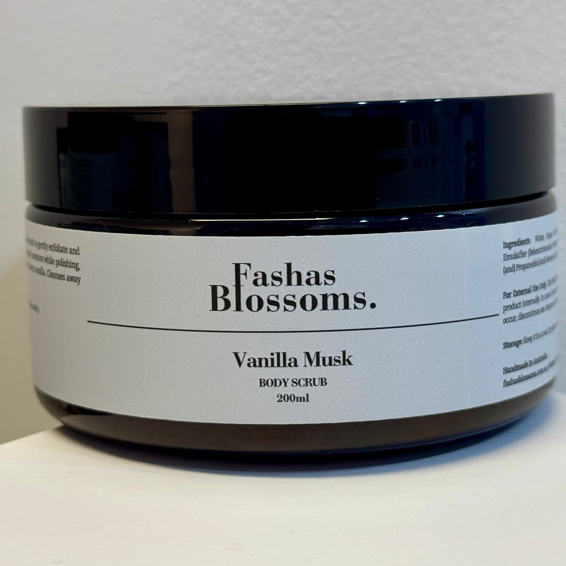 Jar of Fashas Blossoms Vanilla Musk body scrub on a white surface with a light gray background